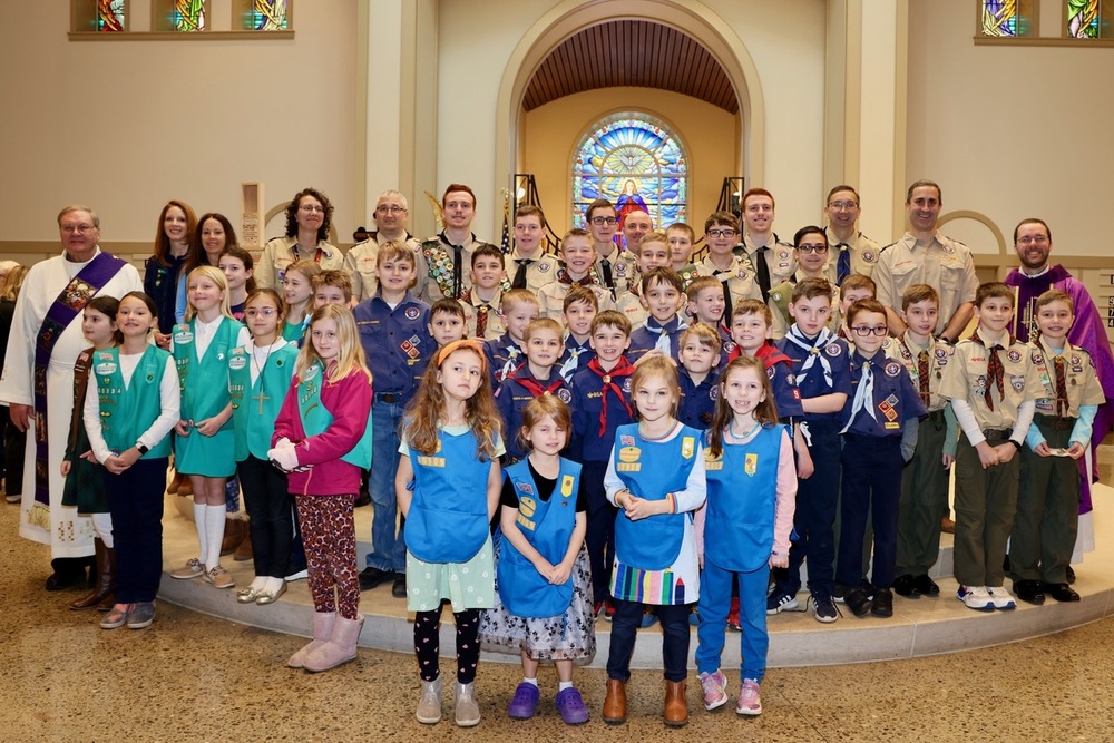 Scouts and Counselors in group photo with Deacon and Father Luke