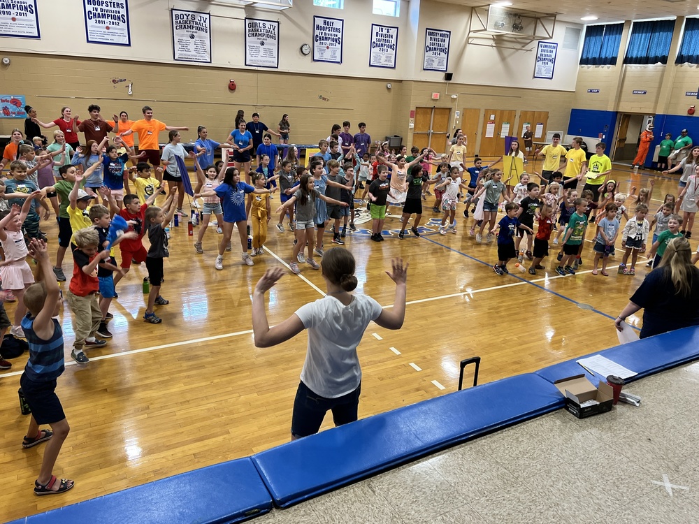 Gym full of children dancing