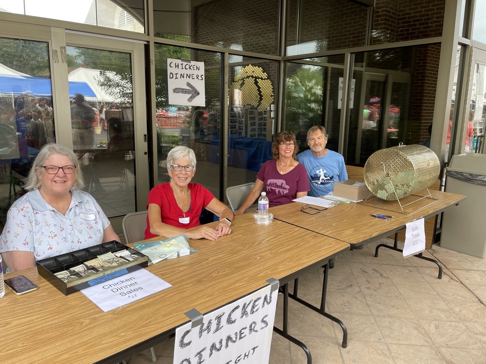 four volunteers at table