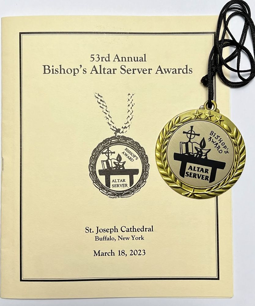 Cover of Server of the Year program and medal