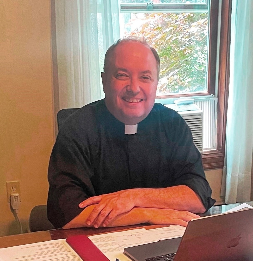 Fr. Tom Mahoney at desk