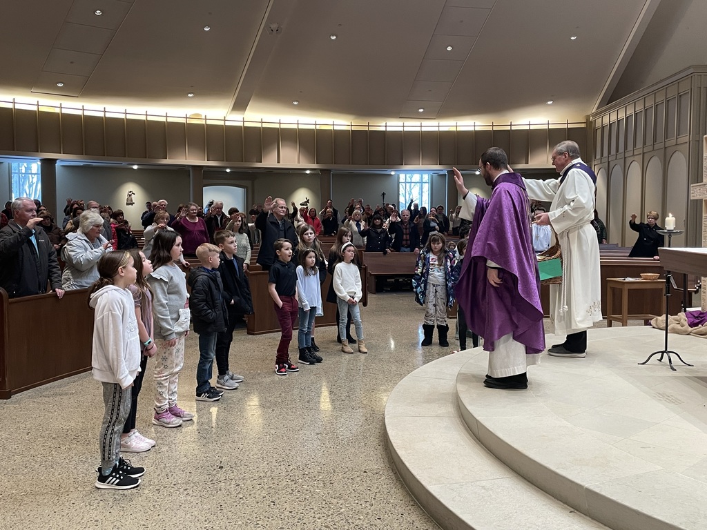 children receiving a blessing at church